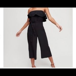 Aritzia Babaton black strapless jumpsuit with tie waist.